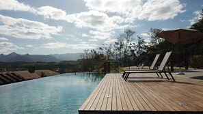 Outdoor pool, open 8:00 AM to 8:00 PM, pool loungers