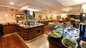 A buffet area with various food stations, including fruits, salads, and hot dishes. - Ilci Residence Hotel (Ankara)