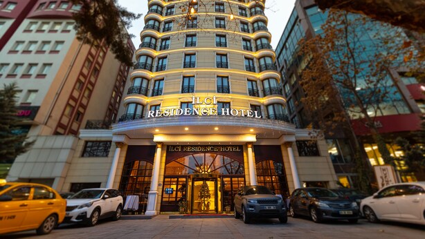 The Ilci Residence Hotel entrance with a modern design, multiple floors, and a prominent entrance with a glass facade. - Ilci Residence Hotel (Ankara)