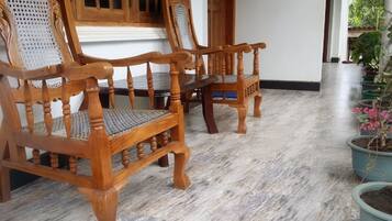 Deluxe Quadruple Room, 2 Queen Beds, Smoking, Garden View | In-room safe, desk, soundproofing, free WiFi