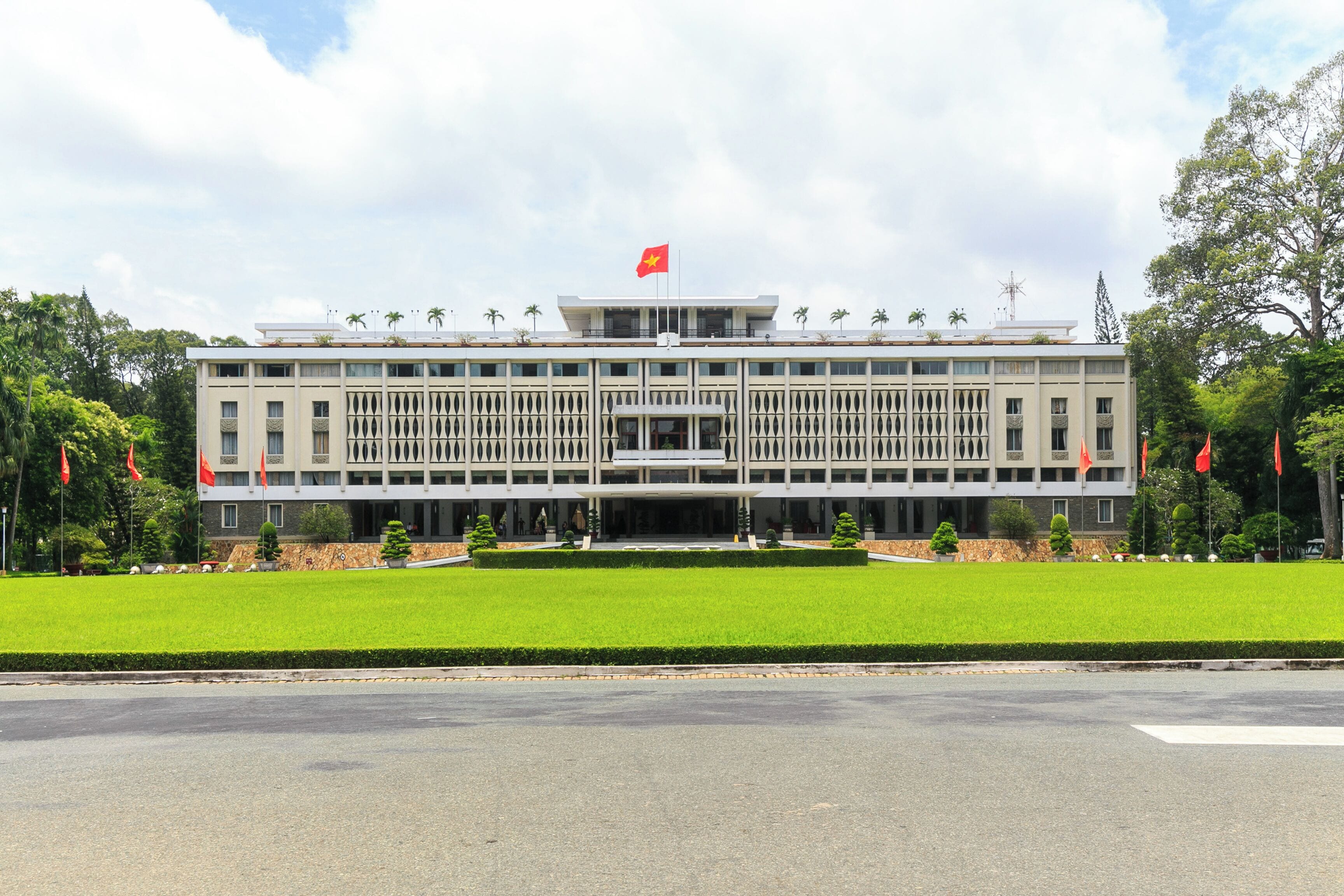 A large, modern building with a symmetrical facade, multiple windows, and a central entrance.