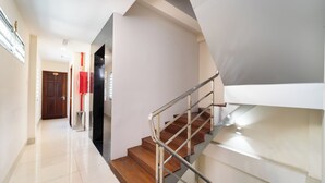 A modern staircase with metal railings and wooden steps, leading to an upper floor. - Sai Gon Park Hotel (Ho Chi Minh City)
