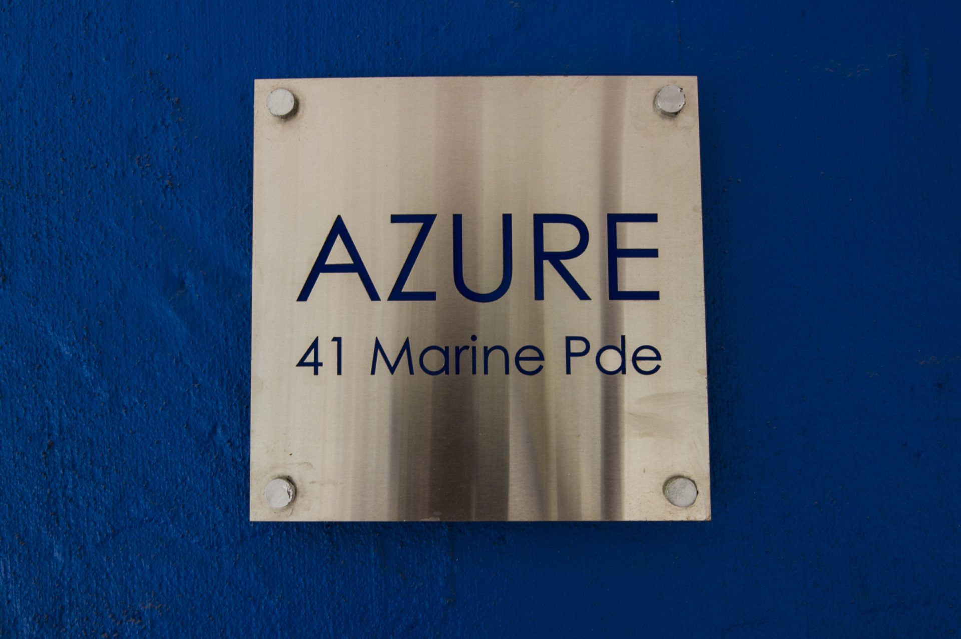 A sign with the text "AZURE 41 Marine Pde".