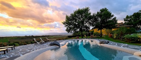 Seasonal outdoor pool, pool loungers