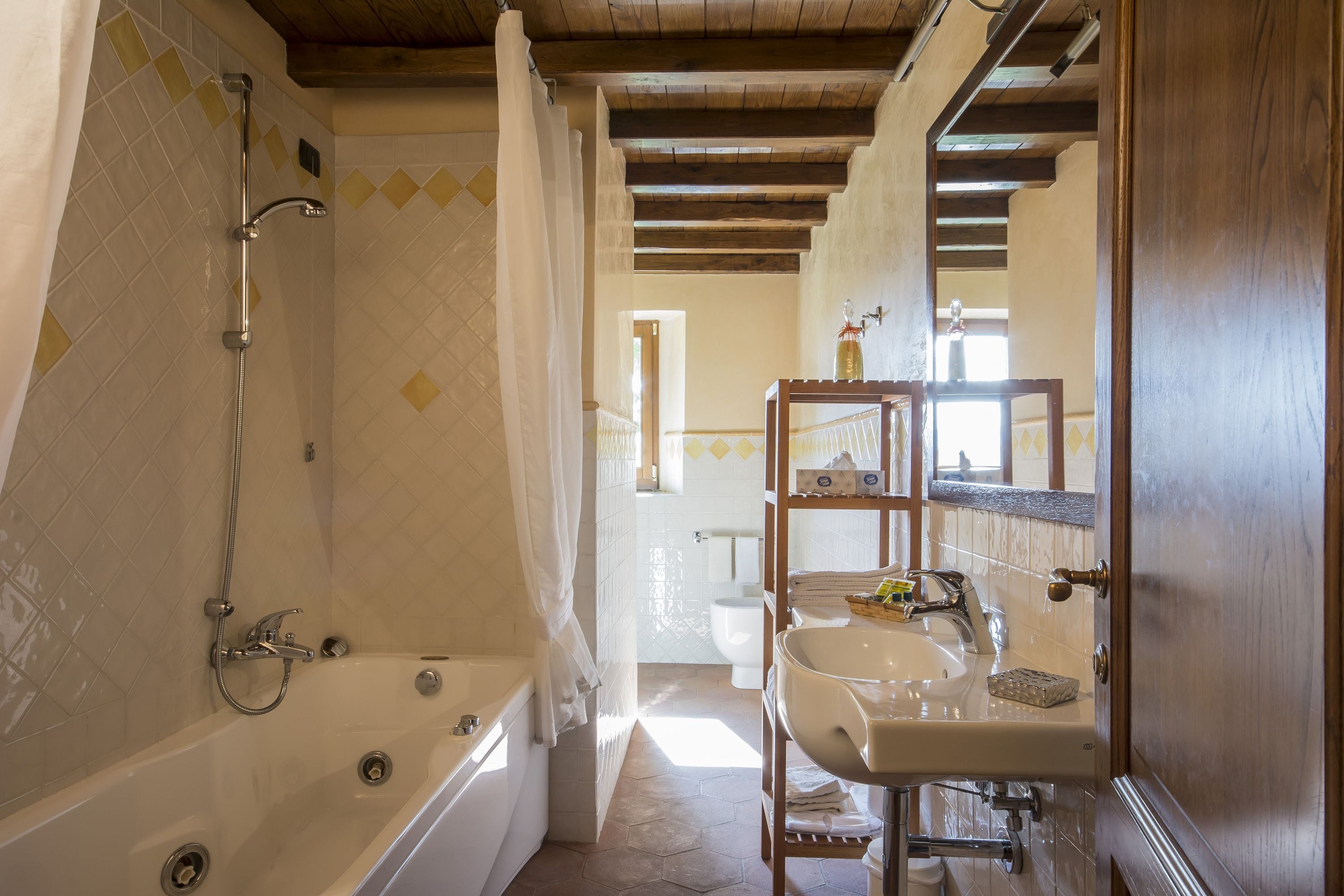 A bathroom with a bathtub, a sink, and a shower.