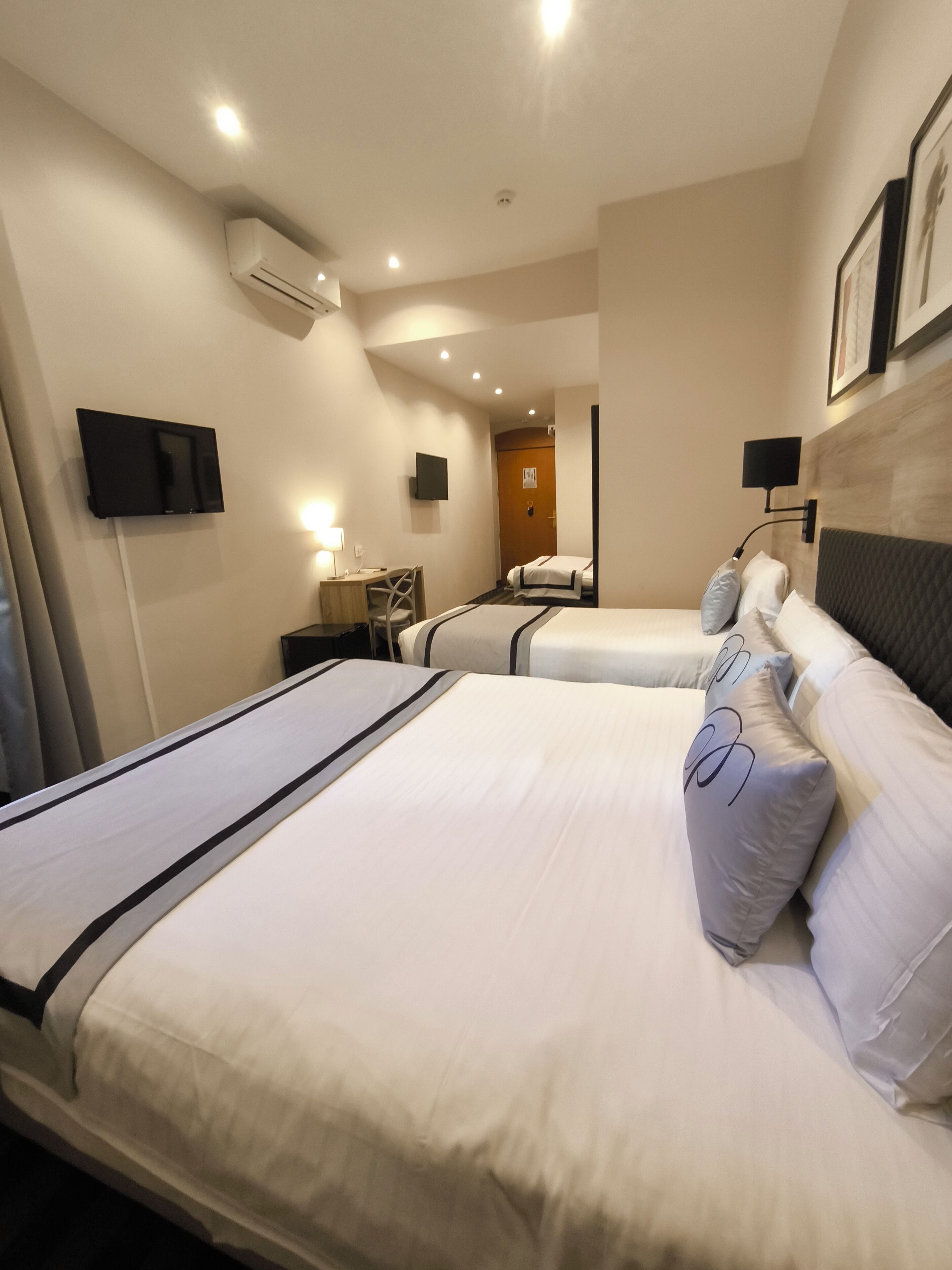 economy quadruple room, ground floor | minibar, in-room safe, desk, soundproofing