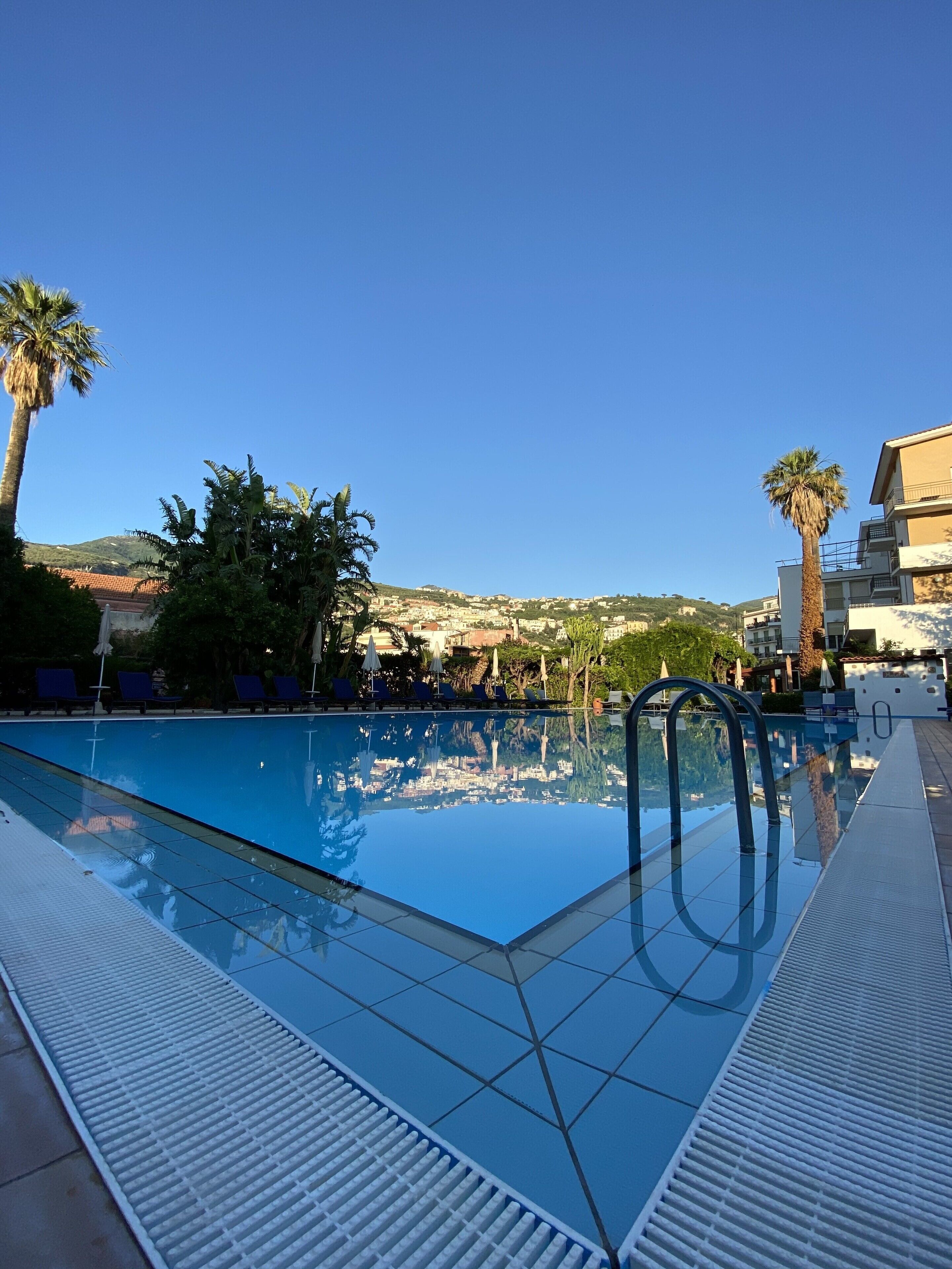 seasonal outdoor pool, open 9:30 am to 7:00 pm, pool umbrellas