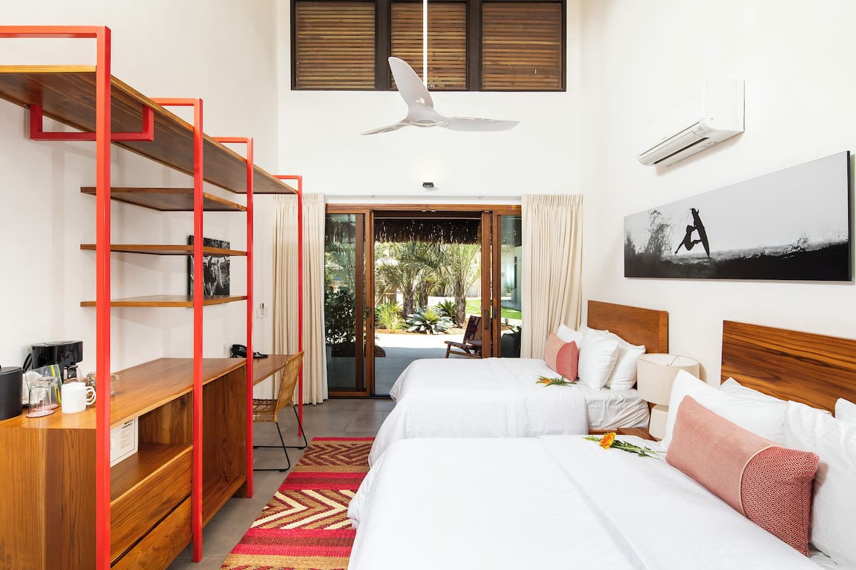 Standard Double Room | Minibar, in-room safe, desk, blackout drapes