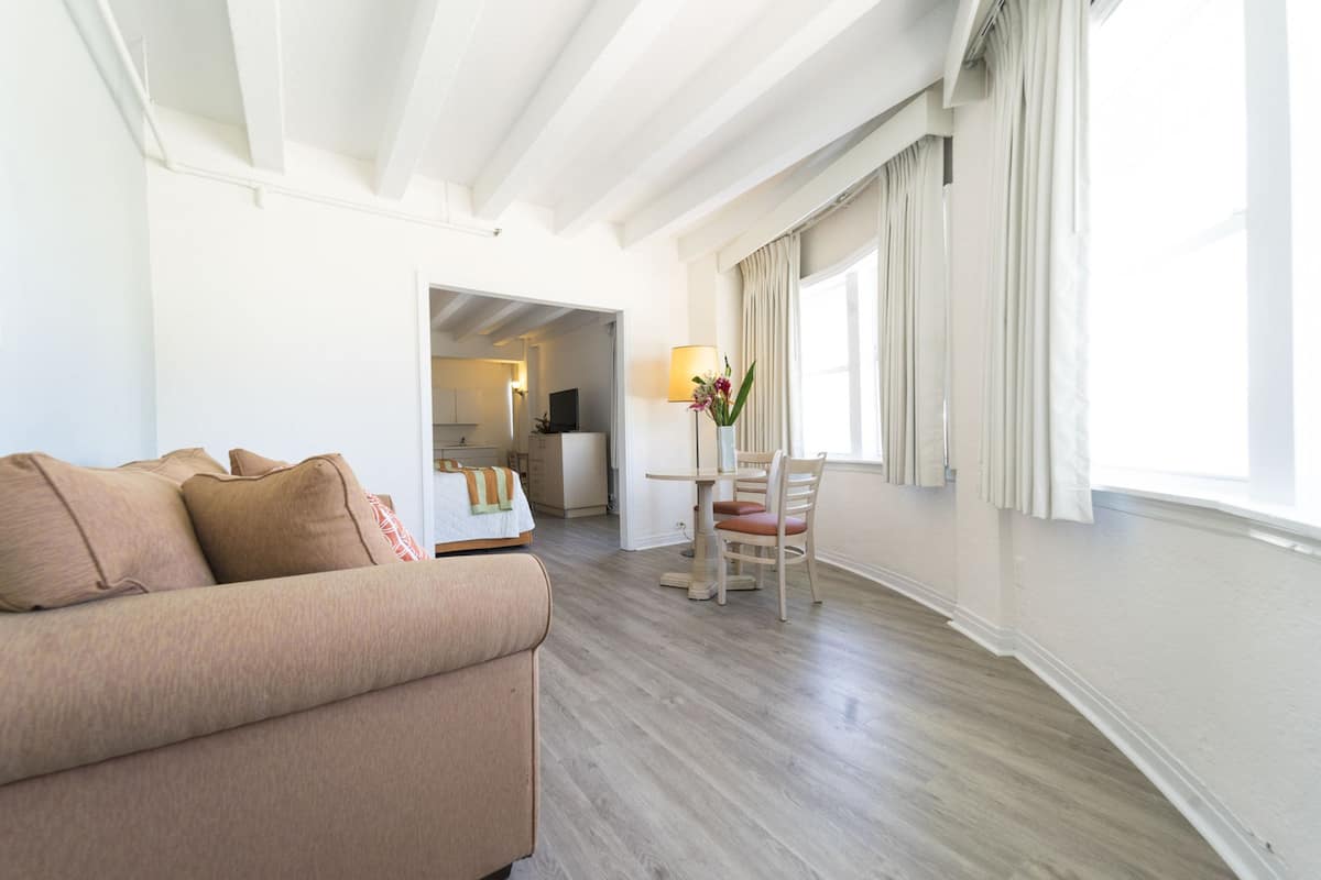 Deluxe Suite, 2 Double Beds, Ocean View | Living area | 34-inch TV with cable channels