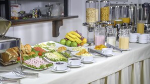 A buffet table with various food items and beverages. - Golden Sunrise Machupicchu (Machu Picchu)