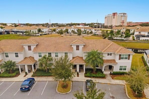 Stylish townhouses with covered porches and well-manicured lawns.