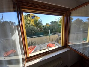 Enjoy a view of the city from the large window, which frames the room with a beautiful outlook.