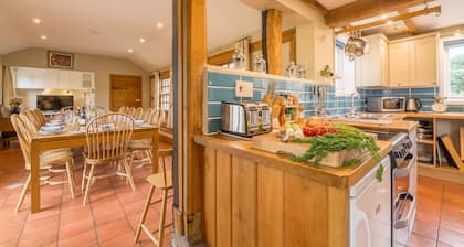 Two properties next door to each other with a games room, hot tub and bicycles