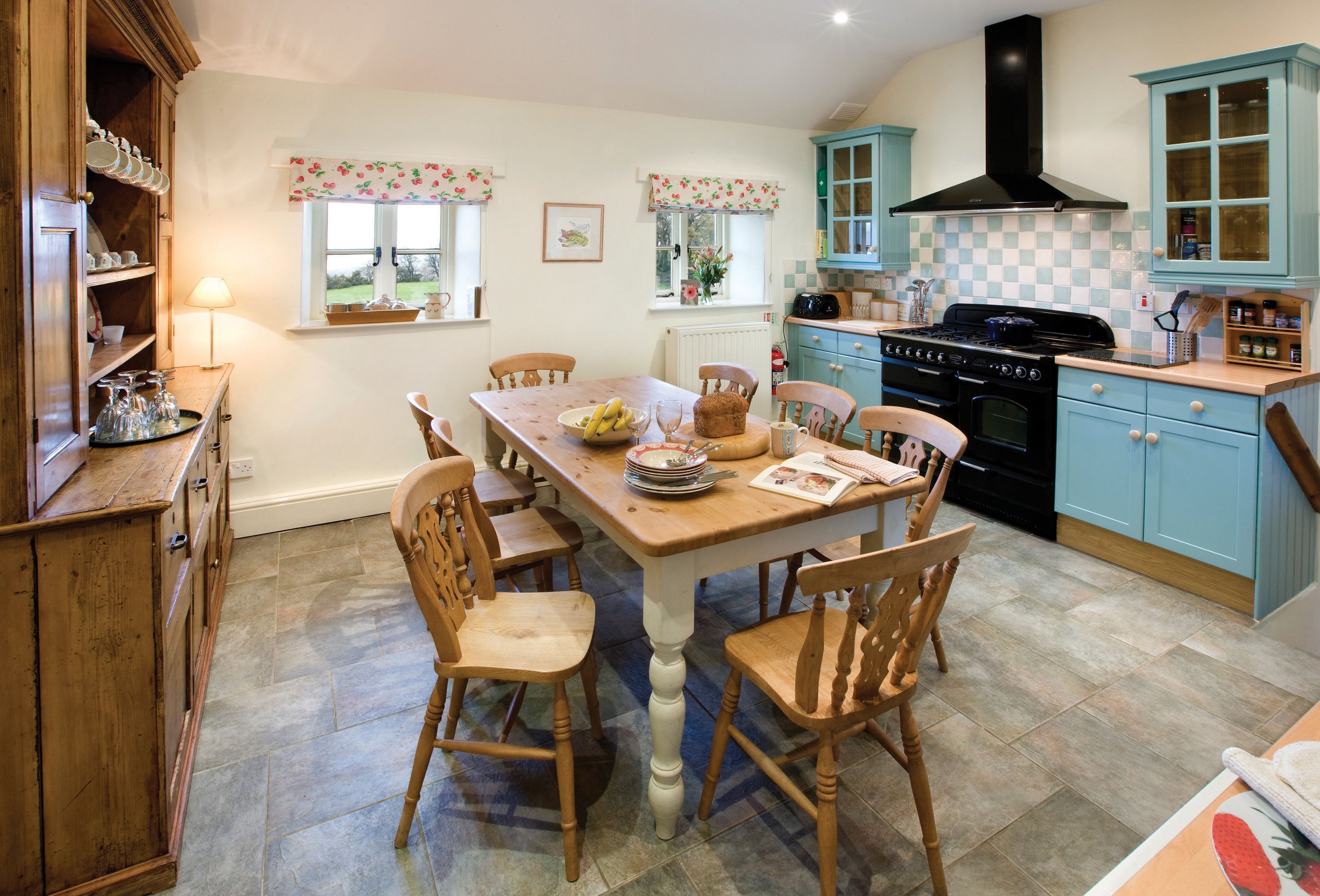 Ground floor: four steps from hallway to kitchen with breakfast table
