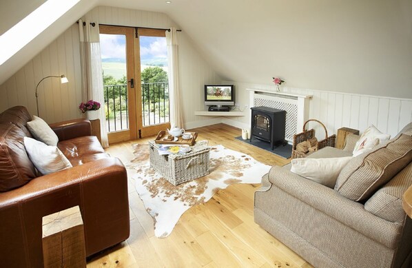 First floor: Spacious open-plan sitting area with Juliette balcony