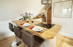 First floor: Fully fitted kitchen with solid oak worktops, breakfast bar and integrated appliances