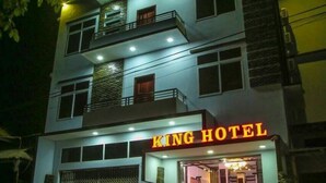 A multi-story hotel with a prominent "KING HOTEL" sign. - King Hotel (Katha)