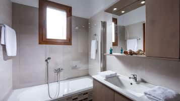 Combined shower/tub, hair dryer, towels, soap