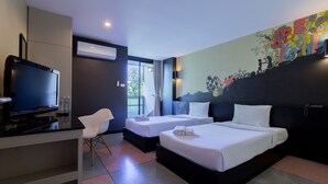 A hotel room with two beds, a TV, a desk, and a mural on the wall. - Pentahug Hotel (Ubon Ratchathani)