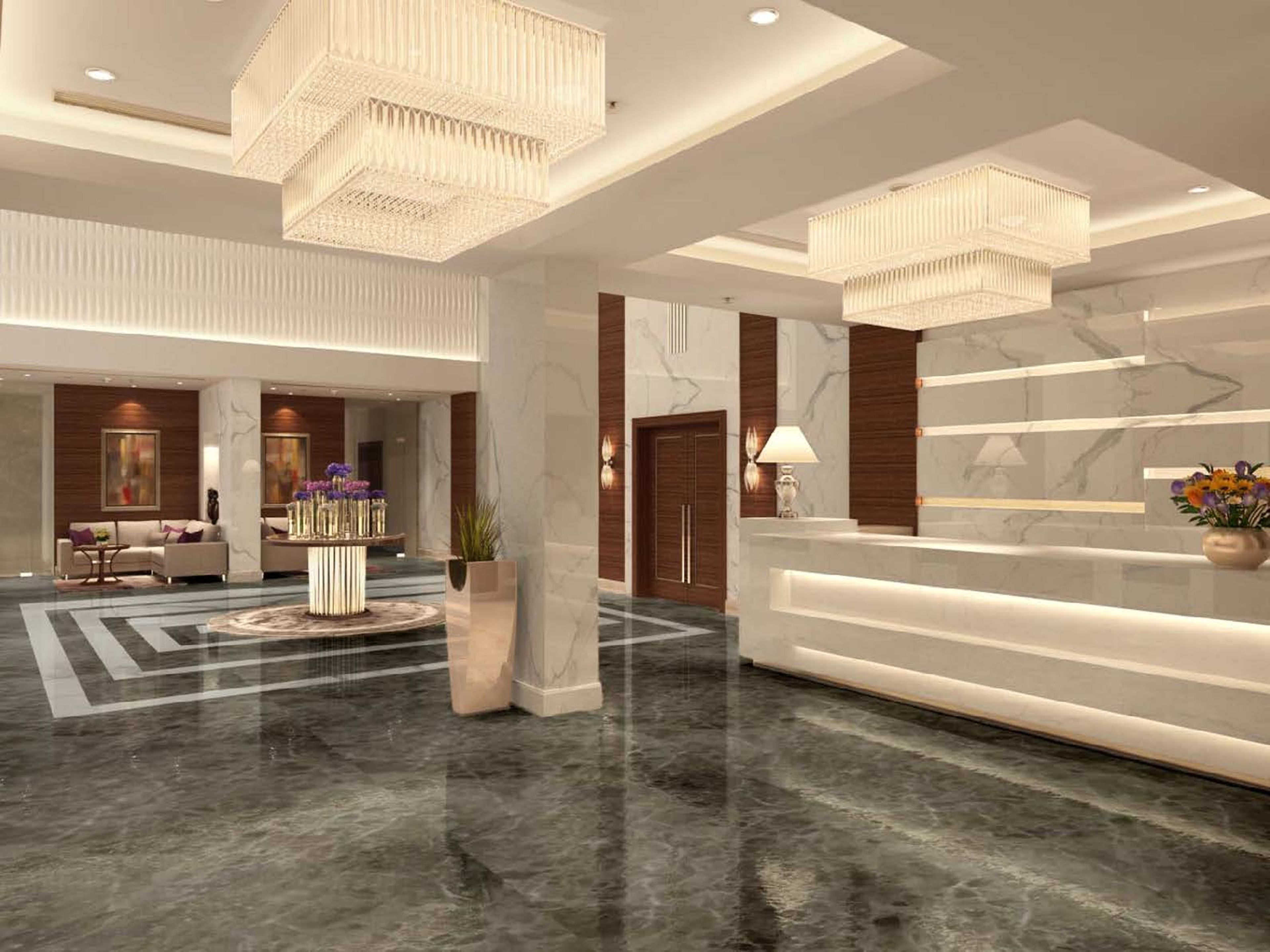 Eine moderne Hotellobby mit Empfangsschalter, Sitzgelegenheiten und dekorativer Beleuchtung.
