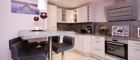 Fridge, microwave, oven, high chair
