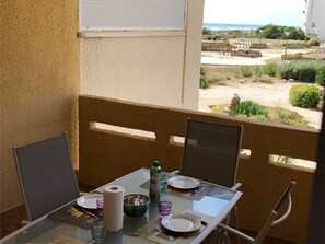 Outdoor dining - Cozy Beachfront T2 Apartment with Cabin, Parking & Modern Amenities (Port Leucate)
