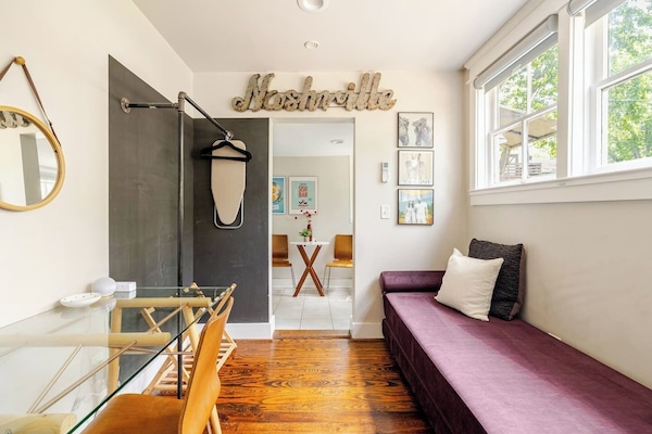 day bed pulls out to make extra bedding, ironing board and hangers