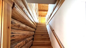 A wooden staircase with a view of the upper floor. - Rustic 1 bedroom, 1 bath, 2 minutes from the West Glacier Park (West Glacier)
