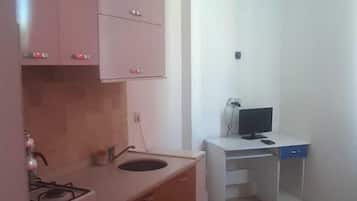 Standard Apartment, 1 Bedroom, Garden View, Garden Area | Living area | Flat-screen TV