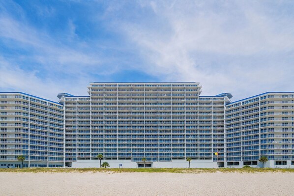 A large, multi-story hotel with a modern design, featuring a symmetrical facade and a flat roof.