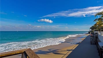 On the beach, sun loungers, beach towels