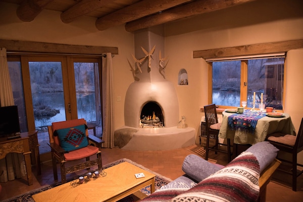 When it's cold outside in winter it's cozy by the kiva fireplace