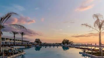 Indoor pool, 4 outdoor pools, open 10 AM to 6 PM, pool umbrellas