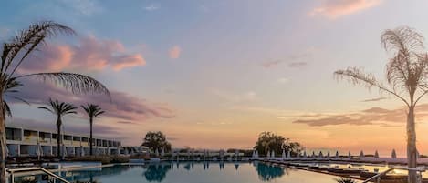 Indoor pool, 4 outdoor pools, open 10 AM to 6 PM, pool umbrellas