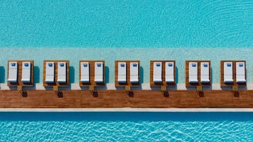 Indoor pool, 4 outdoor pools, open 10 AM to 6 PM, pool umbrellas