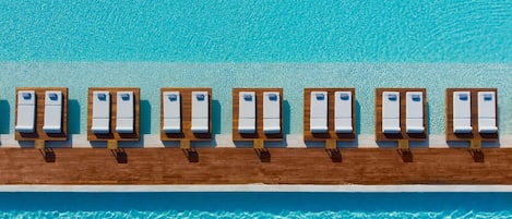 Indoor pool, 4 outdoor pools, open 10 AM to 6 PM, pool umbrellas