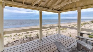 A wooden deck with a view of the beach and ocean. - 9819 Shore - Beachfront on Primehook Beach. (Milford)