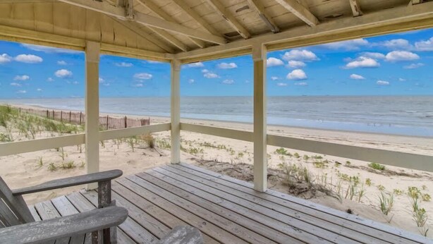 A wooden deck with a view of the beach and ocean. - 9819 Shore - Beachfront on Primehook Beach. (Milford)