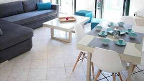 Deluxe Apartment, 1 Bedroom, Balcony, City View | Living area | Flat-screen TV - Geo Holidays Studios (Trifylia)