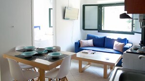 Apartment, 1 Bedroom, Balcony, City View | Living area | Flat-screen TV - Geo Holidays Studios (Trifylia)