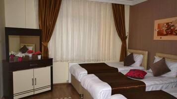 Standard Triple Room | Minibar, desk, iron/ironing board, free WiFi