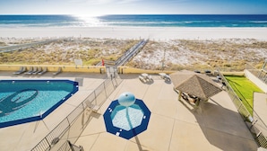 A pool area with a clear view of the beach and ocean. - Phoenix 4 4031 Beachfront (Orange Beach)