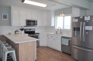 Fridge, microwave, stovetop, dishwasher - Spacious Oceanfront Retreat – A Coastal Gem for Families & Friends (North Topsail Beach)