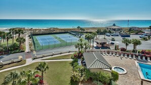 A resort with a tennis court, pool, and ocean view. - Beach Walks, Sunset Views & Coastal Bliss – Islander 417 (Destin)
