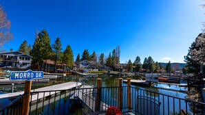 A marina with docked boats, a clear blue sky, and a street sign reading "Morro Dr."