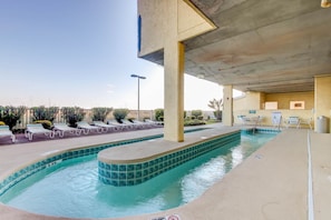 A swimming pool with lounge chairs and a covered area. - Recently Updated, Wonderful Oceanfront Views + Free Attraction Tickets! (North Myrtle Beach)