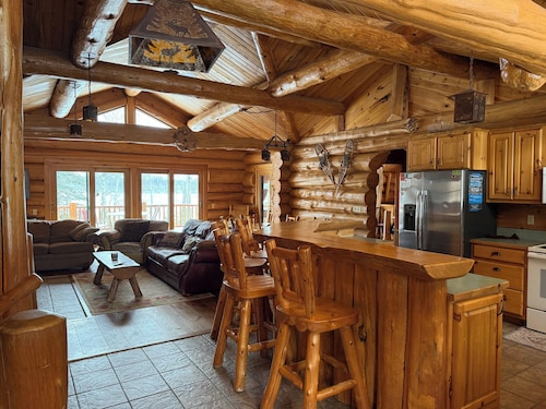 Handcrafted log lodge on Minnesota’s clearest lake. Nestled in the woods.