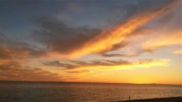 On the beach, sun loungers, beach towels
