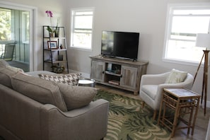 Enjoy the comfortable living room with elegant tropical furnishing, cable & wifi