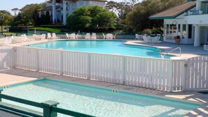 A swimming pool with white chairs and a white fence. - Let yourself be "Swept Away"  BOOK OUR BEAUTIFUL HOME NOW FOR 2026 (Corolla)